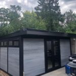 Black And Grey Composite Garden Building With Flyover And Windows Along The Side