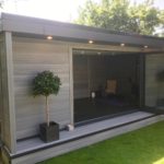 Composite Garden Building With Bi Fold Doors Open During Summer