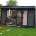 Composite Garden Building With French Style Bi Fold Doors And Flyover