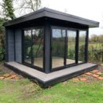 Composite Garden Building With Surround Windows In A Farmland Setting